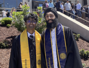 Arvind and Sehej smile in front of International House at Berkeley on graduation day wearing their stoles.